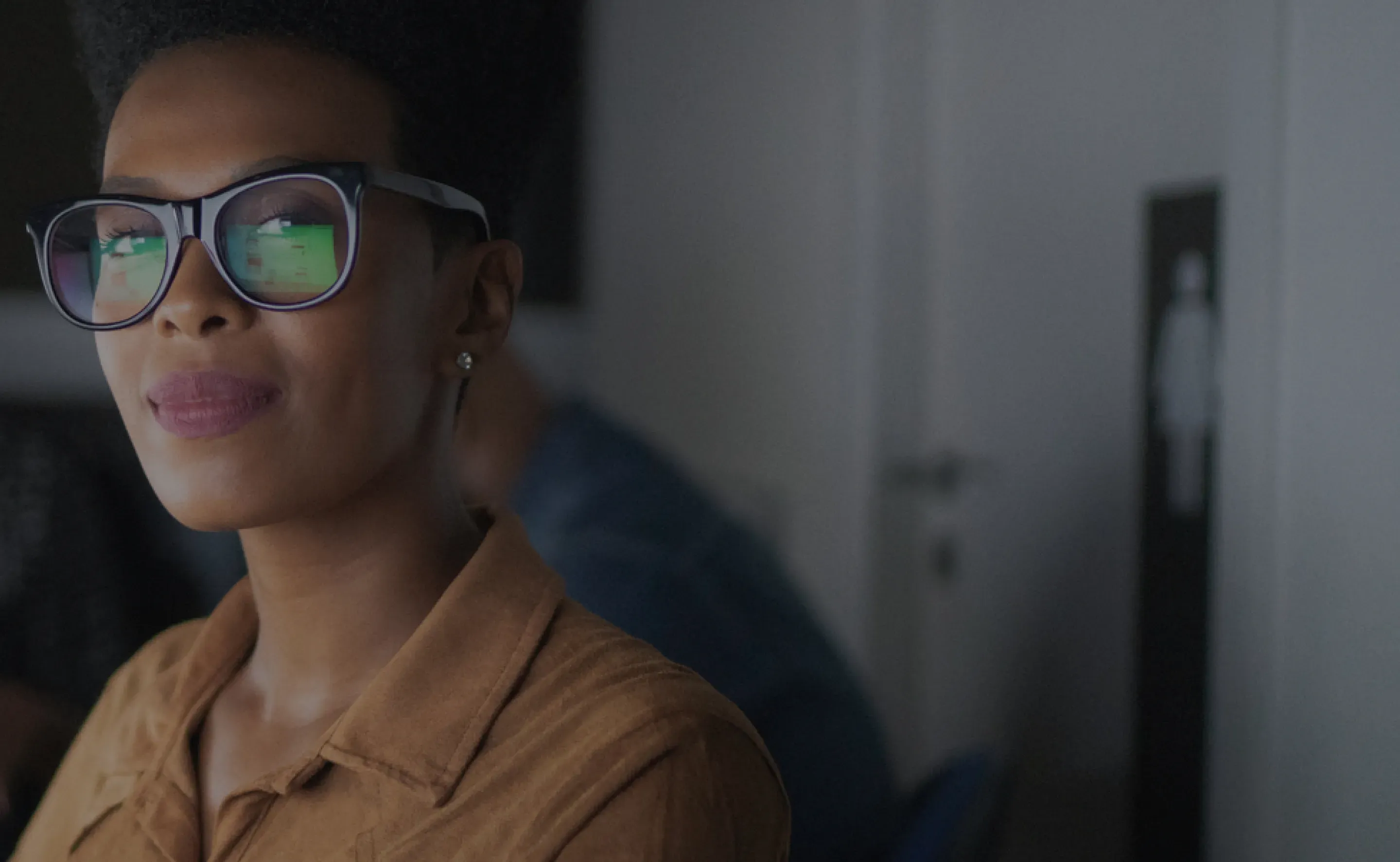 Customer looking at a computer screen while wearing glasses